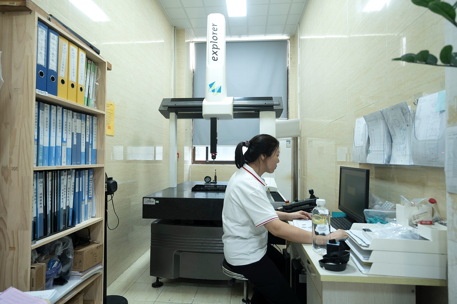 JingZhan quality technician operating a coordinate measuring machine