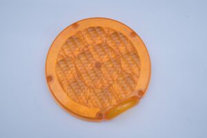 Orange optical injection moulded lens component produced by JingZhan